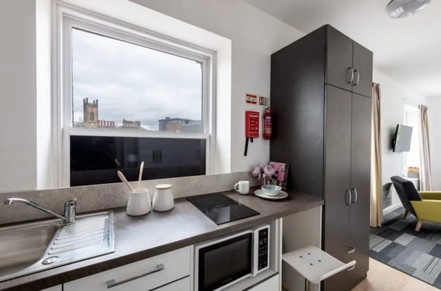 Sink microwave cabinets and oven kitchen area at The Arch - Liverpool in Liverpool Student Accommodation