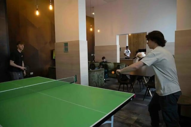 Ping pong table with people playing recreation area at The View - Newcastle in Newcastle Upon Tyne Student Accommodation