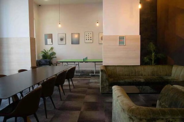 Long table ping pong table sofas common area at The View - Newcastle in Newcastle Upon Tyne Student Accommodation