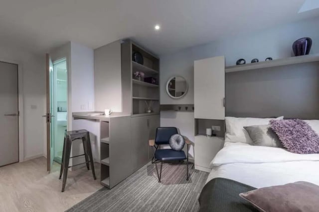 Bed with purple pillows, bar stool, chair bedroom at Verde in Newcastle Upon Tyne Student Accommodation