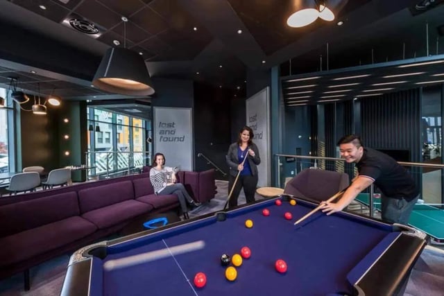 People play pool in a modern common area at Verde in Newcastle Upon Tyne Student Accommodation