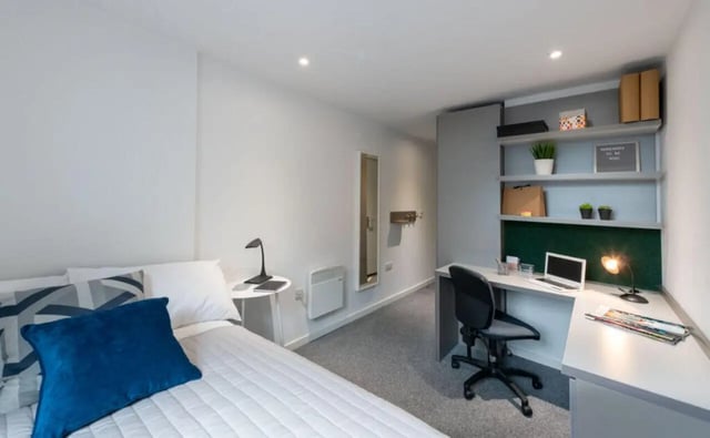 Bed desk and shelves in student accommodation bedroom at Verde in Newcastle Upon Tyne Student Accommodation