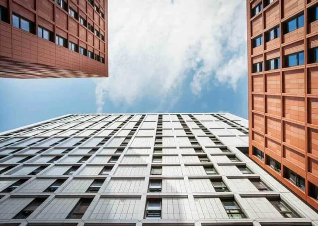 Modern buildings with many windows exterior at City Village in Coventry Student Accommodation