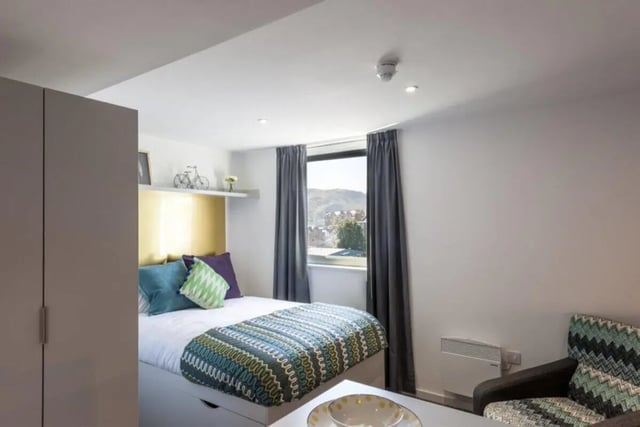 Bed wardrobe and patterned bedding bedroom at New Park in Edinburgh Student Accommodation