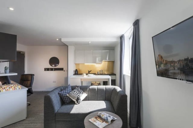 Sofa kitchen and TV area living room at New Park in Edinburgh Student Accommodation