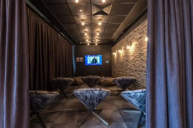 Beanbags and unique chairs facing screen entertainment room at West View in Glasgow Student Accommodation
