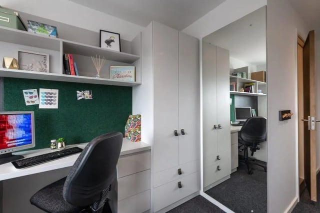 Desk computer chair shelves and mirrored wardrobe study area at West View in Glasgow Student Accommodation