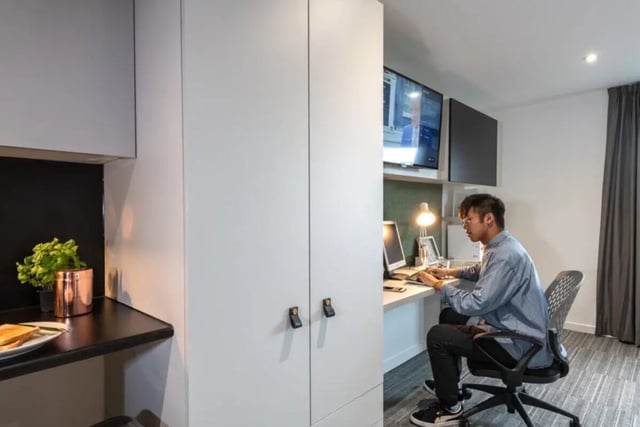 Student working at desk with monitors study area at West View in Glasgow Student Accommodation