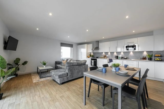Sofa kitchen island dining table living room at The Bridge in Newcastle Upon Tyne Student Accommodation