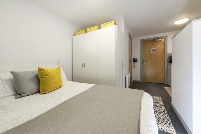 Bed wardrobe yellow boxes door and telephone bedroom at Marshall Court in Newcastle Upon Tyne Student Accommodation