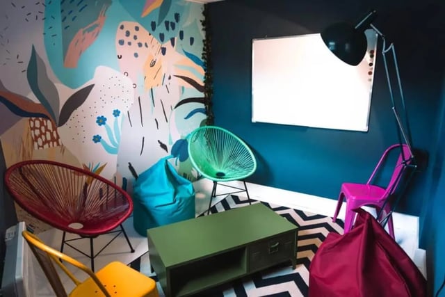Chairs beanbags coffee table whiteboard living room at Stonebridge House in Bristol Student Accommodation