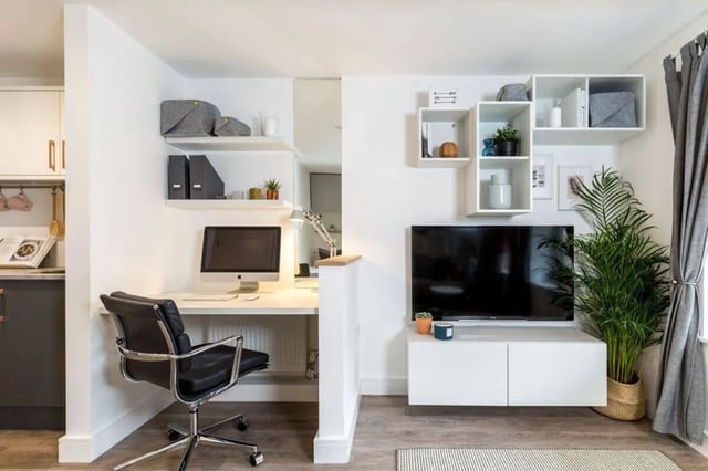 Desk computer chair and TV living room at Blockyard Apartments in Exeter Student Accommodation