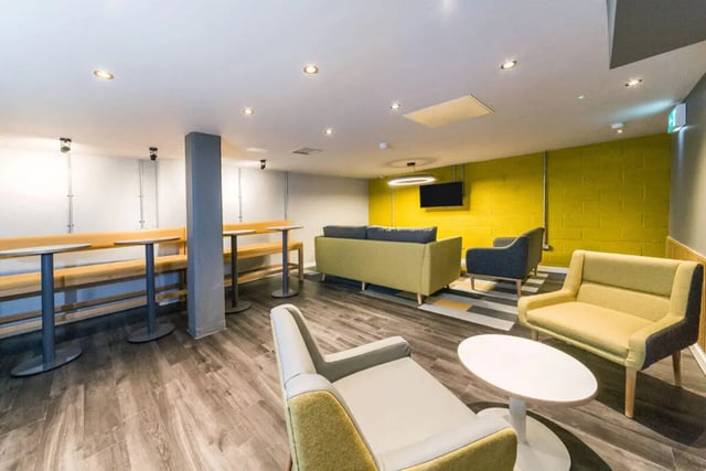 Sofa chairs tables benches and TV common room at Quayside Court in Newcastle Upon Tyne Student Accommodation