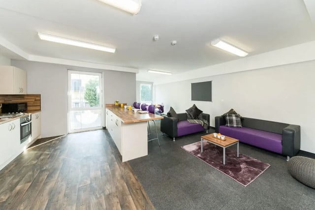 Kitchen with couches and coffee table living room at Quayside Court in Newcastle Upon Tyne Student Accommodation