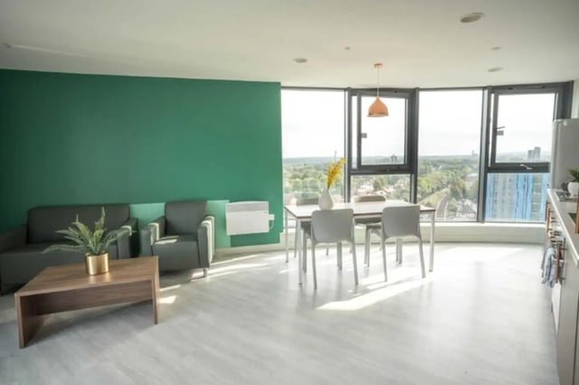 Sofa dining table chairs with view living room at The Toybox in Birmingham Student Accommodation