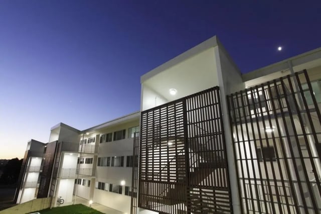 Modern student housing with balconies and wooden screens exterior at Murdoch University Village in Perth Student Accommodation