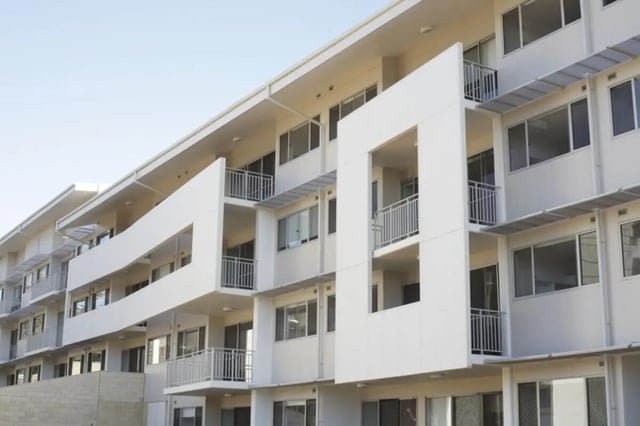 Modern white building balconies windows railings exterior at Murdoch University Village in Perth Student Accommodation