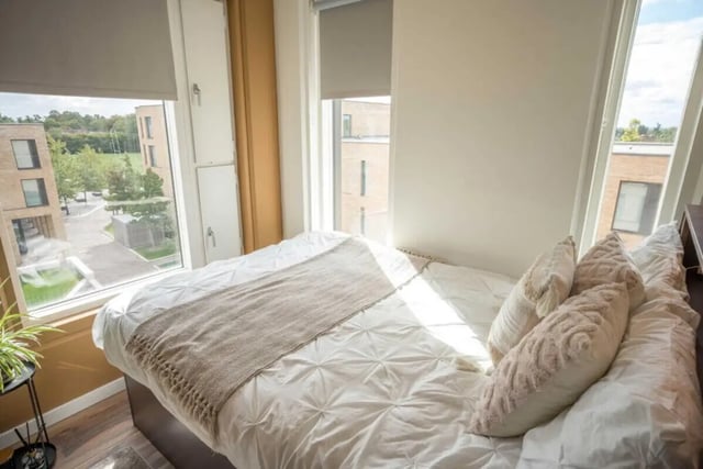 Bed with white duvet and pillows bedroom at Hox Park in Egham Student Accommodation