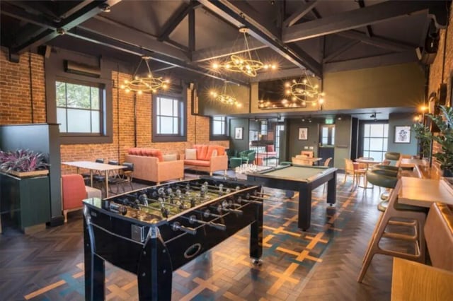 Foosball table pool table lounge seating common area at Hox Park in Egham Student Accommodation