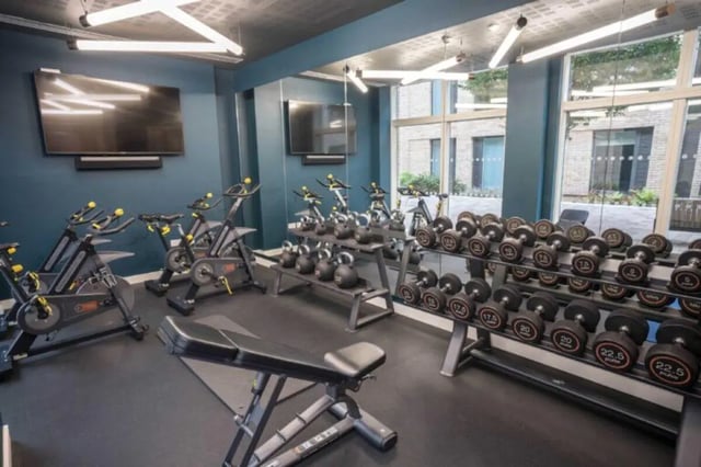 Spin bikes kettlebells dumbbells and bench Gym at Hox Park in Egham Student Accommodation