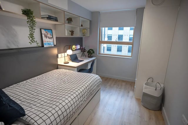 Bed desk shelf and laundry basket bedroom at The Depot in Bath Student Accommodation