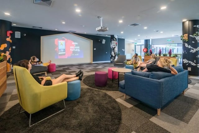 Students relaxing in a common area living room at Student Village - University of Melbourne Campus in Melbourne Student Accommodation