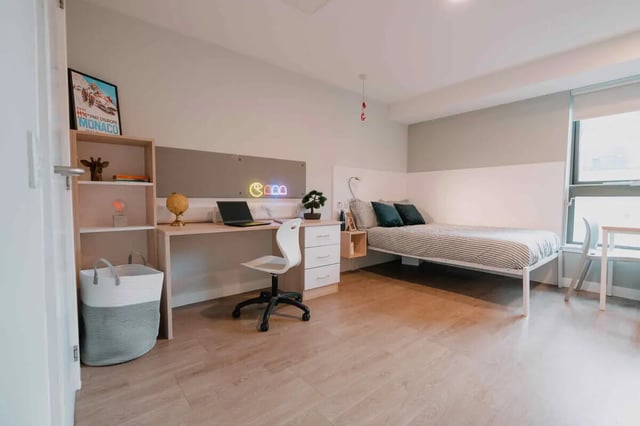 Bed desk shelving and basket bedroom at Base in Glasgow Student Accommodation