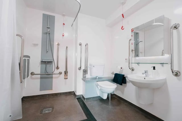 Accessible shower toilet sink mirror bathroom at Base in Glasgow Student Accommodation