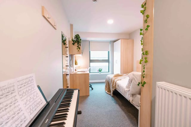 Piano bed wardrobe desk and mirror bedroom at Base in Glasgow Student Accommodation