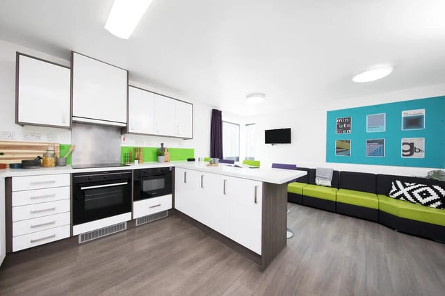 Modern kitchen with island and lounge area living room at Prospect Point in Liverpool Student Accommodation