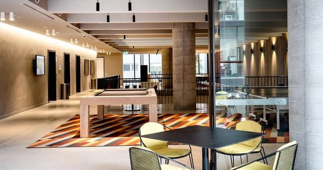 Billiard table ping pong table chairs lounge area at Iglu South Yarra in Melbourne Student Accommodation