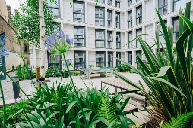 Ping pong table bench plants courtyard exterior at Market House in Newcastle Upon Tyne Student Accommodation