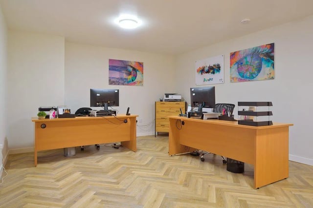Two desks with computers and artwork study area at Keiller Court in Dundee Student Accommodation