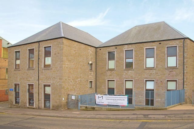 Stone building with multiple windows advertising exterior at Keiller Court in Dundee Student Accommodation
