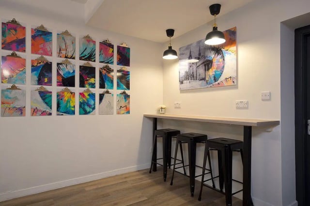 Abstract art clipboards bar stools and counter area at King Street 207 in Aberdeen Student Accommodation
