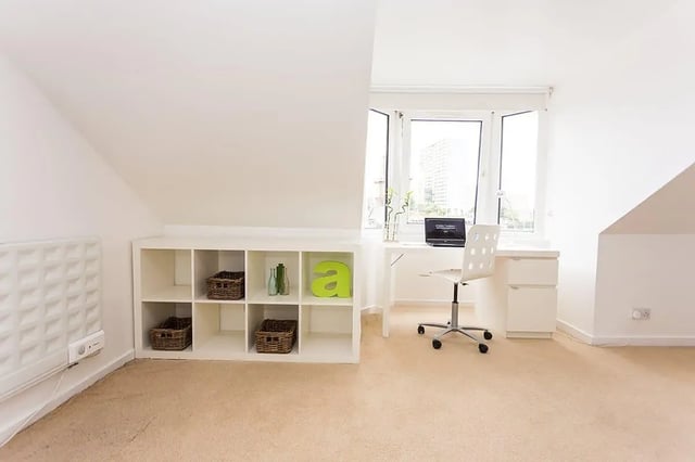 Shelving unit desk chair laptop window study area at King Street 207 in Aberdeen Student Accommodation