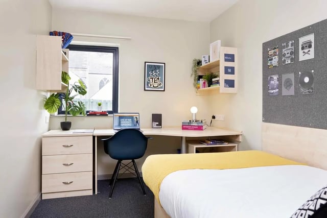 Desk laptop chair plant drawers bed bedroom at St Thomas Court in Plymouth Student Accommodation