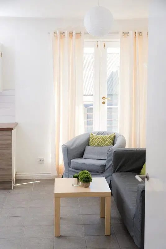 Armchair sofa coffee table with plants living room at Linksfield in Aberdeen Student Accommodation