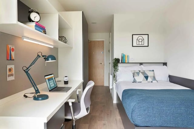 Desk lamp laptop chair bed and shelves bedroom at Edinburgh Gorgie in Edinburgh Student Accommodation