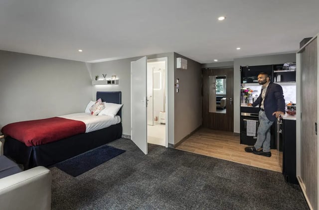 Bed shower kitchen and man studio apartment at Study Inn Walnut Gardens Exeter in Exeter Student Accommodation