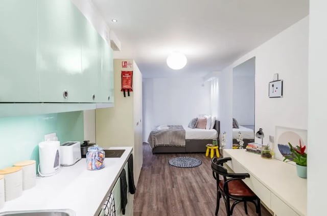 Kitchenette bed study desk large mirror studio at The Stay Club - Camden in London Student Accommodation