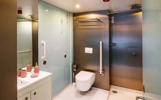 Toilet sink and shower visible bathroom at The Stay Club - Kentish Town in London Student Accommodation