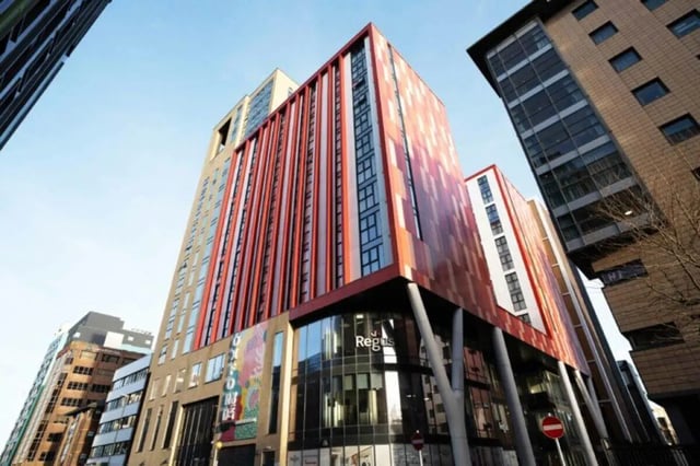 Modern student accommodation building with red exterior exterior at Oxford Point in Bournemouth Student Accommodation