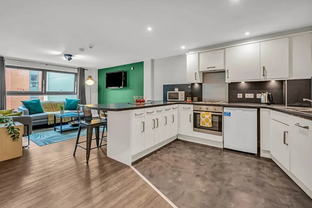 Sofa kitchen island oven and TV living room kitchen at The Triangle in Leeds Student Accommodation