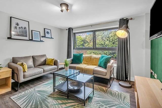 Two sofas coffee table framed art living room at The Triangle in Leeds Student Accommodation