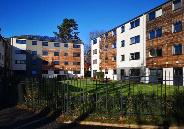 Modern student buildings with solar panels and picnic tables exterior at Forest Court in Loughborough Student Accommodation