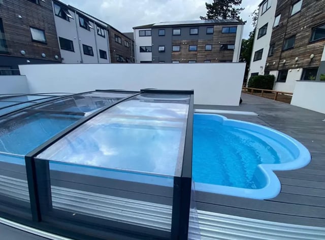 Covered swimming pool and blue pool exterior at Forest Court in Loughborough Student Accommodation