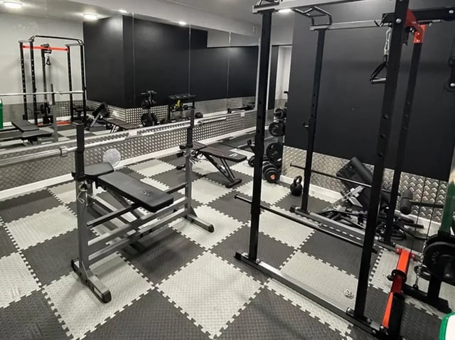 Gym equipment weights and benches gym area at Forest Court in Loughborough Student Accommodation