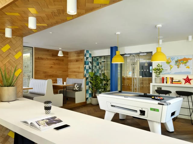 Pool table booths and plants communal area at Student Castle Edinburgh in Edinburgh Student Accommodation