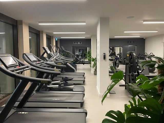 Treadmills and exercise machines in a gym. at Student Castle Oxford in Oxford Student Accommodation
